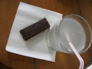 german chocolate cake jocalat bar, glass of coconut water